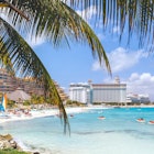 1165435852
Cancun beach with hotels and plam tree in foreground - stock photo
Cancun beach with hotels and plam tree in foreground