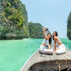 Young beautiful Asian woman friends using mobile phone photography together while travel on boat passing island beach lagoon in sunny day. Happy female enjoy and fun outdoor lifestyle on summer vacation trip
1390578195
Young Asian woman friends using mobile phone photography together while travel on boat on summer vacation. - stock photo
Young beautiful Asian woman friends using mobile phone photography together while travel on boat passing island beach lagoon in sunny day. Happy female enjoy and fun outdoor lifestyle on summer vacation trip