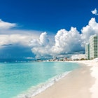 A sweep of beach and sea in Cancun, Mexico.