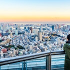 Asia Business concept for real estate and corporate construction - Tourists take shot of Tokyo Tower under bright golden sun and vivid twilight sky in Roppongi Hill, Tokyo, Japan  License Type: media  Download Time: 2022-01-07T13:43:08.000Z  User: gwencotter  Is Editorial: No  purchase_order:
Adult, Building, City, Cityscape, Horizon, Male, Man, Nature, Outdoors, Person, Photography, Scenery, Sky, Urban
