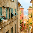 Perspective of the old downhill street leading to the Genova port, Genoa, Liguria, Italy, License Type: media, Download Time: 2024-10-01T18:13:33.000Z, User: Ppeterson948, Editorial: false, purchase_order: 65050, job: BIT 2025, client: BIT 2025, other: Pia Peterson Haggarty