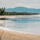 A beautiful view on a sandy tropical beach at Esterillos East at Pacific Coast of Costa Rica. People enjoying afternoon walking at the beach., License Type: media, Download Time: 2025-01-24T11:44:20.000Z, User: sashabrady26, Editorial: false, purchase_order: 65050 - Digital Destinations and Articles, job: Lonely Planet, client: Best surf spots in Costa Rica, other: Sasha Brady