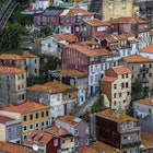 View from Dom Luis I Bridge on the old part of Porto city, including of the Funicular dos Guindais ascending the hill