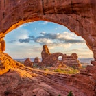 Turret arch through the North Window at Arches National Park in Utah  License Type: media  Download Time: 2023-04-14T12:35:08.000Z  User: Norma.PrauseBrewer_LonelyPlanet  Is Editorial: No  purchase_order: